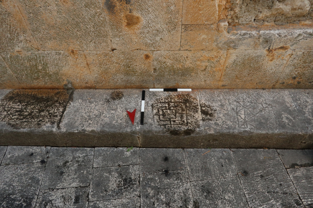 Historic game boards carved into stone in Trogir, Croatia
